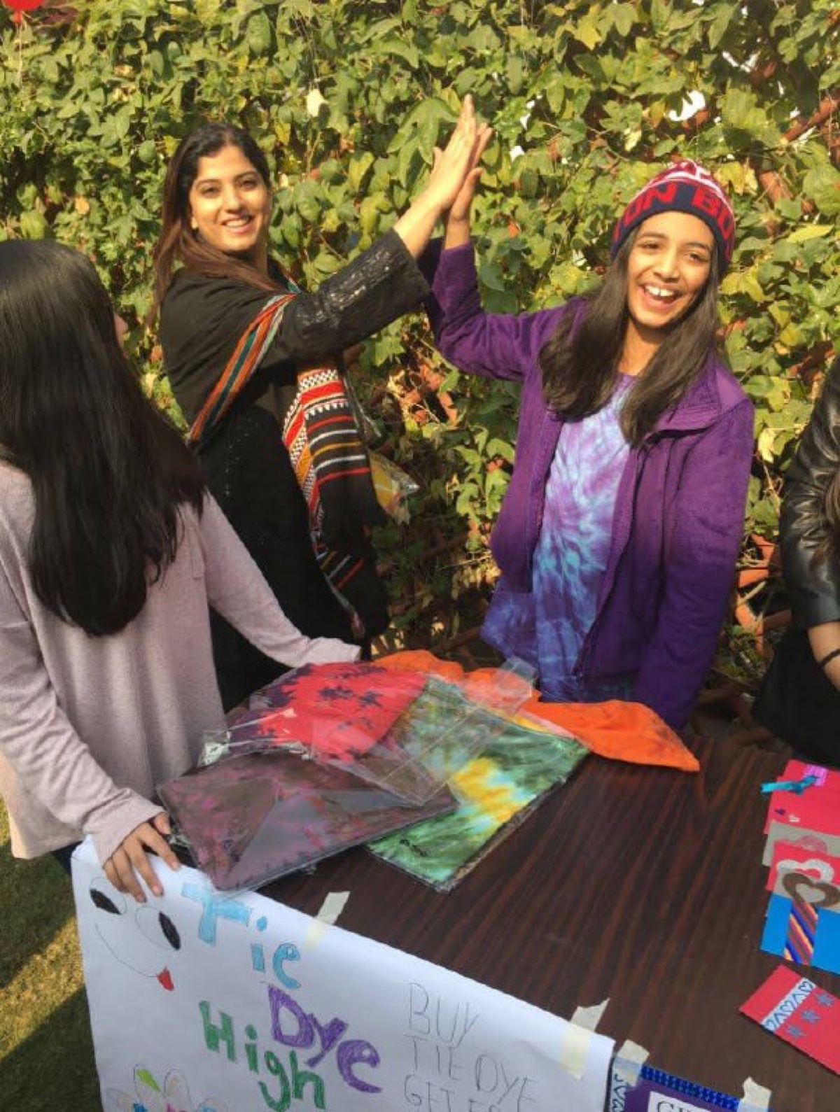 Ujala high-fiving a student at Acton Academy Ann Arbor